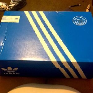 Selling a brand new pair of woman’s adidas size 11 , black and pink, never worn.